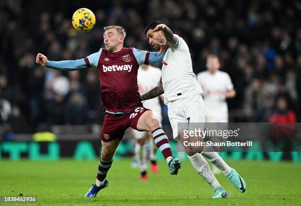 Jarrod Bowen of West Ham United battles for possession with Cristian Romero of Tottenham Hotspur during the Premier League match between Tottenham...