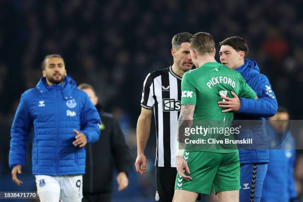 Fabian Schaer of Newcastle United and Jordan Pickford of Everton clash following the Premier League match between Everton FC and Newcastle United at...