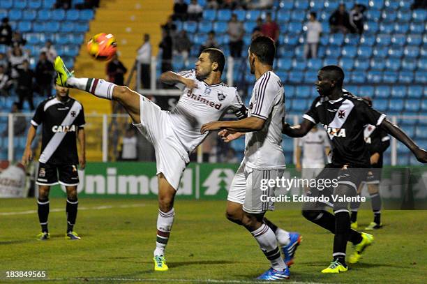 Edinho of Fluminense fights for the ball with Jomar of Vasco during the match between Vasco and Fluminense for the Brazilian Series A 2013 at...