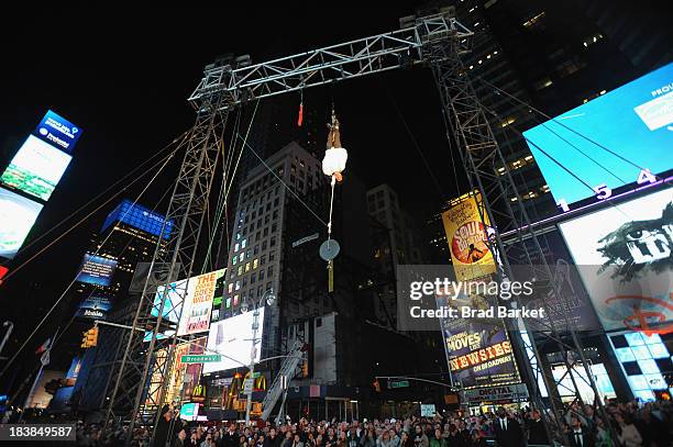 Criss Angel performs Double Straight Jacket Escape in the middle of Times Square for his new Spike TV series "Criss Angel BeLIEve" on October 9, 2013...