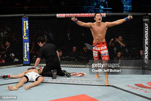 Dong Hyun Kim celebrates after knocking out Erick Silva in their welterweight bout during the UFC Fight Night event at the Ginasio Jose Correa on...