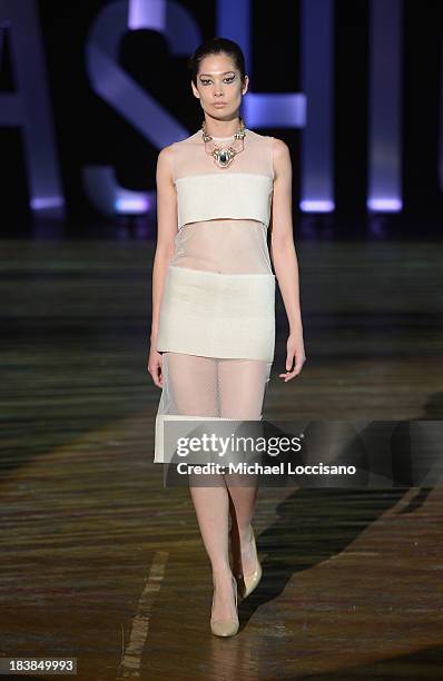 Model wearing Sukeina walks the runway during the 3rd Annual United Colors Of Fashion Gala at Lexington Avenue Armory on October 9, 2013 in New York...