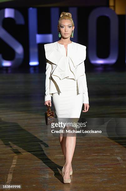 Model wearing Sukeina walks the runway during the 3rd Annual United Colors Of Fashion Gala at Lexington Avenue Armory on October 9, 2013 in New York...