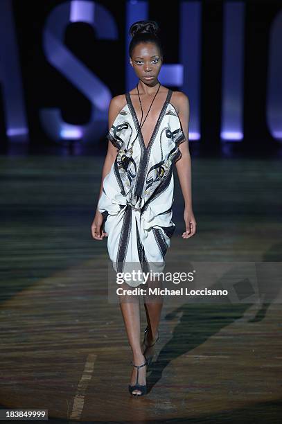 Model wearing Sukeina walks the runway during the 3rd Annual United Colors Of Fashion Gala at Lexington Avenue Armory on October 9, 2013 in New York...