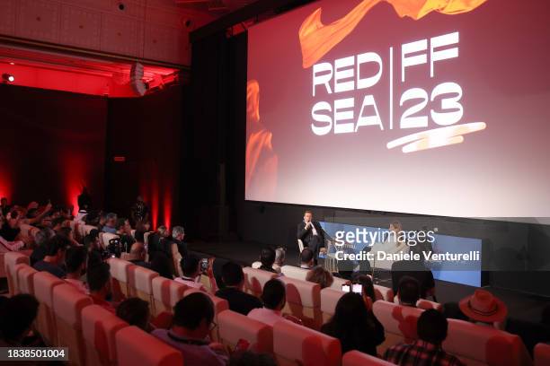 Nicolas Cage and Raya Abirached speak on stage during the In Conversation with Nicolas Cage during the Red Sea International Film Festival 2023 on...