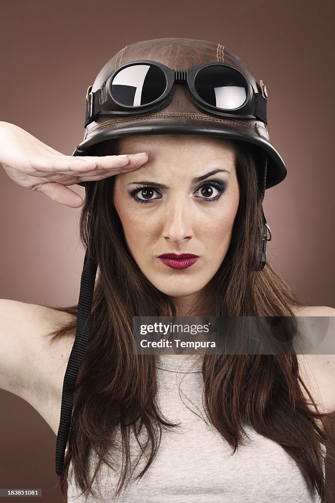 Woman making military salute _ vertical.