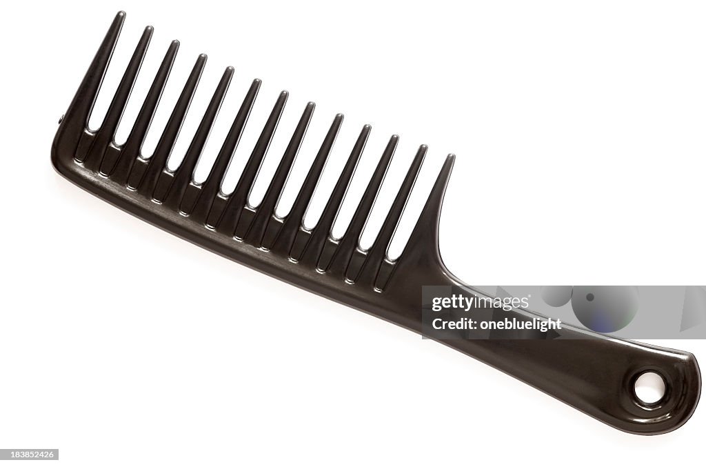 A large black comb on a white background