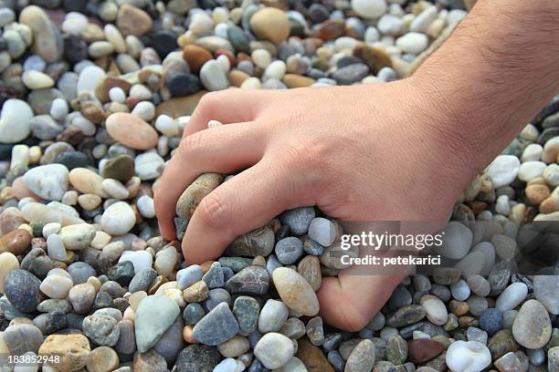 grasp the stones - throwing rocks stock pictures, royalty-free photos & images