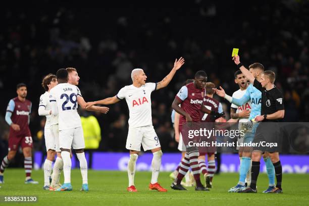 Referee Michael Salisbury awards a yellow card after the final whistle during the Premier League match between Tottenham Hotspur and West Ham United...