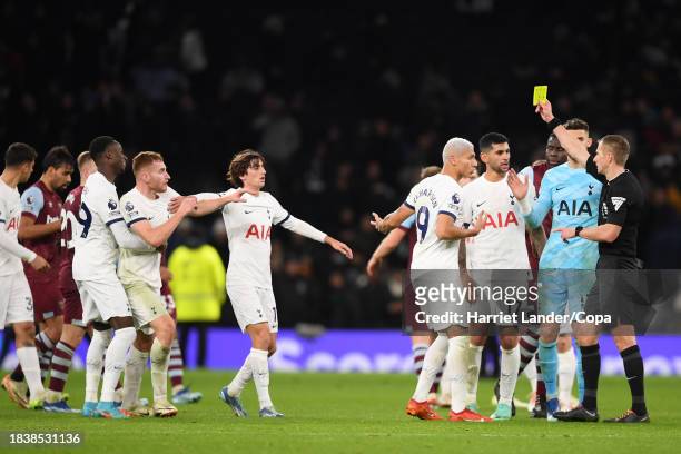 Referee Michael Salisbury awards a yellow card after the final whistle during the Premier League match between Tottenham Hotspur and West Ham United...