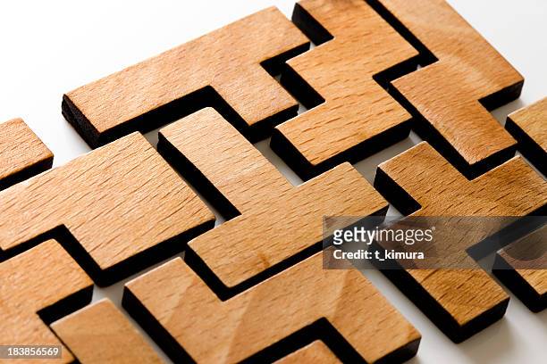 hölzerne puzzle - wooden blocks stock-fotos und bilder