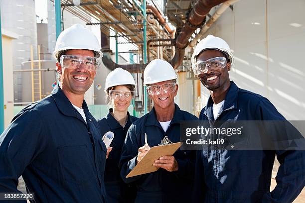 diverse group of workers at manufacturing plant - industrial workers stock pictures, royalty-free photos & images