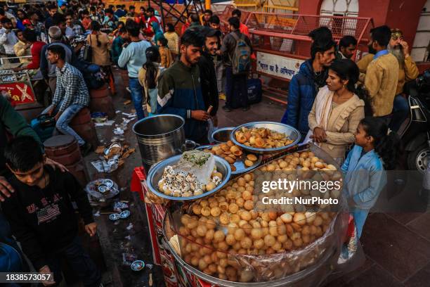 Vendor is selling Paani Puri street food outside the Red Fort in Old Delhi, India, on December 10, 2023.