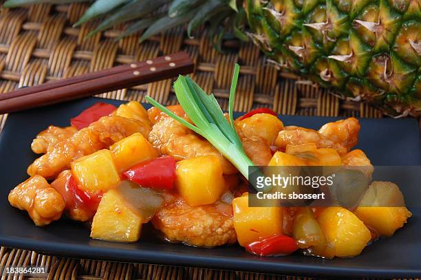 close-up of sweet and sour chicken with pineapples - sour taste stock pictures, royalty-free photos & images