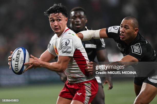 Harlequins' English outside-half Marcus Smith is tackled by Racing92's French centre Gael Fickou during the European Champions Cup first round first...