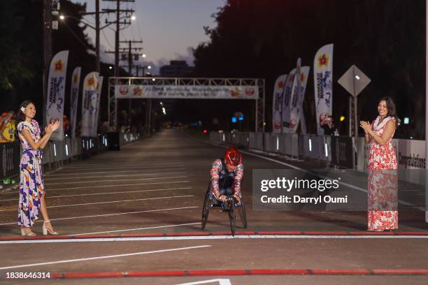 Masazumi Soejima of Japan finishes first in the Men's Wheelchair division of the Honolulu Marathon on December 10, 2023 in Honolulu, Hawaii.