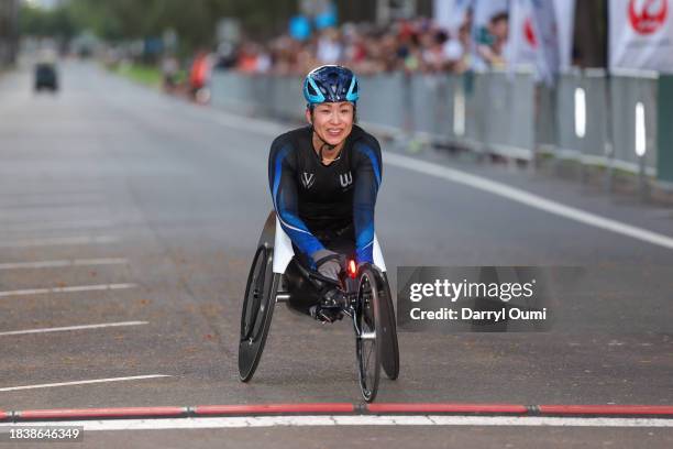 Wakako Tsuchida of Japan finishes first in the Women's Wheelchair division of the Honolulu Marathon on December 10, 2023 in Honolulu, Hawaii.