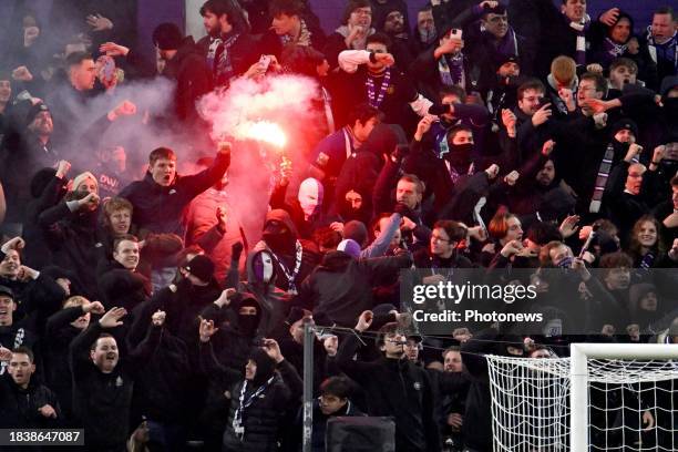 Fans of Anderlecht light up flares during the Jupiler Pro League match between RSC Anderlecht and Standard de Liege on December 10, 2023 in...