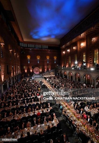 General view shows Nobel Prize laureates, members of the Swedish royal family and guests attending the Nobel Prize Banquet at the City Hall in...