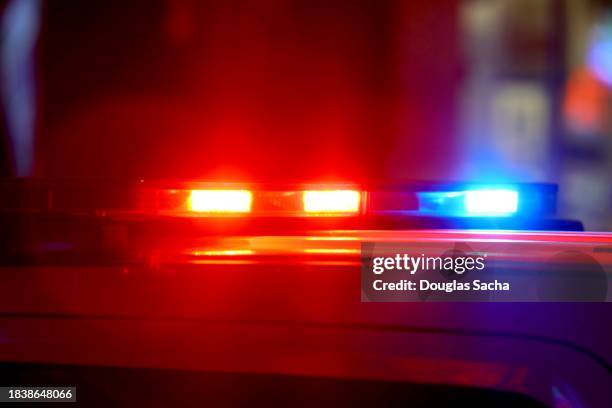 police responding to an emergency with flashing bright lights - police car lights stock pictures, royalty-free photos & images