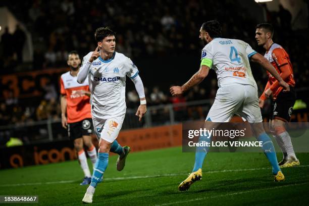 Marseille's Argentine defender Leonardo Balerdi celebrates after scoring a goal during the French L1 football match between FC Lorient and Olympique...