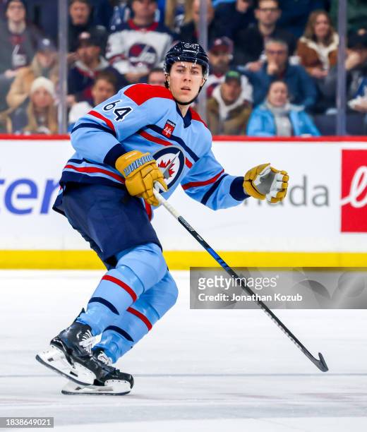 Logan Stanley of the Winnipeg Jets skates during second period action against the Carolina Hurricanes at Canada Life Centre on December 04, 2023 in...