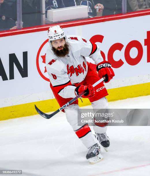 Brent Burns of the Carolina Hurricanes skates during first period action against the Winnipeg Jets at Canada Life Centre on December 04, 2023 in...