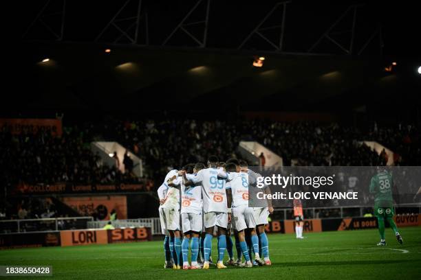 Marseille's players celebrate after scoring a goal during the French L1 football match between FC Lorient and Olympique de Marseille at the Moustoir...