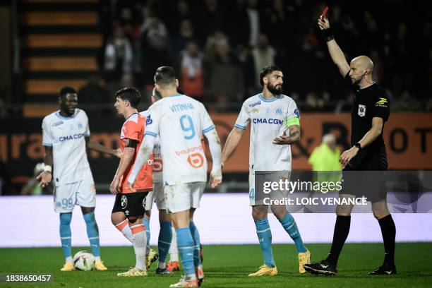 Marseille's French midfielder Jonathan Clauss receives a red card during the French L1 football match between FC Lorient and Olympique de Marseille...