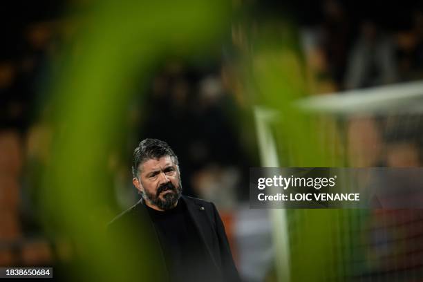 Marseillle's Italian head coach Gennaro Gattuso watches his players warming up prior to the French L1 football match between FC Lorient and Olympique...