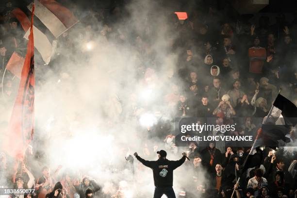 Lorient's supporters cheer during the French L1 football match between FC Lorient and Olympique de Marseille at the Moustoir stadium on December 10,...