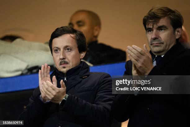 Marseille's president Pablo Longoria and general director Stephane Tessier applaud during the French L1 football match between FC Lorient and...