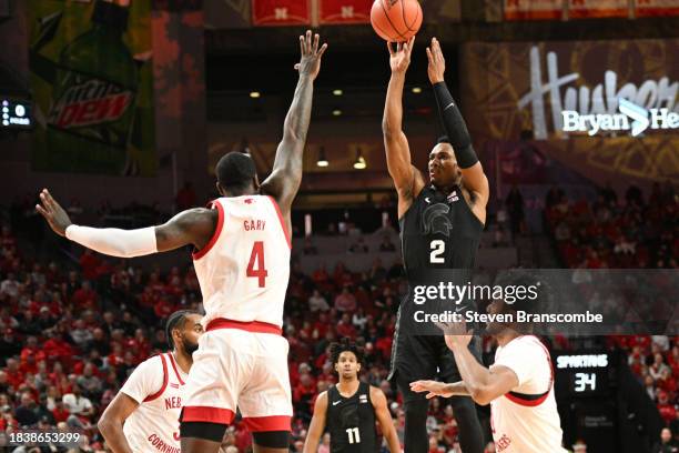 Tyson Walker of the Michigan State Spartans scores on a three point basket against Juwan Gary of the Nebraska Cornhuskers in the second half at...