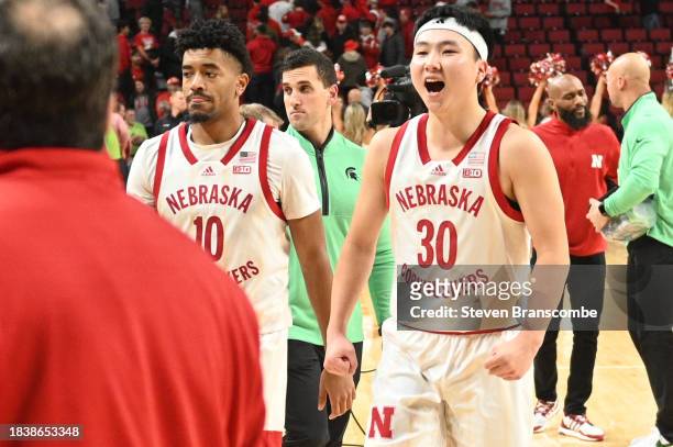 Keisei Tominaga of the Nebraska Cornhuskers and Jamarques Lawrence walk off the floor after the win against the Michigan State Spartans at Pinnacle...