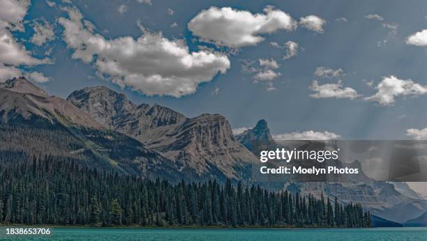 maligne lake as the smoke dissipates - maligne lake stock pictures, royalty-free photos & images