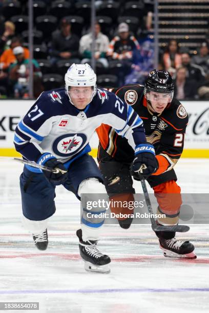 Nikolaj Ehlers of the Winnipeg Jets and Brett Leason of the Anaheim Ducks battle for position during the second period at Honda Center on December...