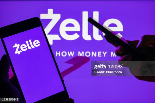 The Zelle online banking logo is being displayed on a smartphone with Zelle visible in the background, in this photo illustration, in Brussels,...
