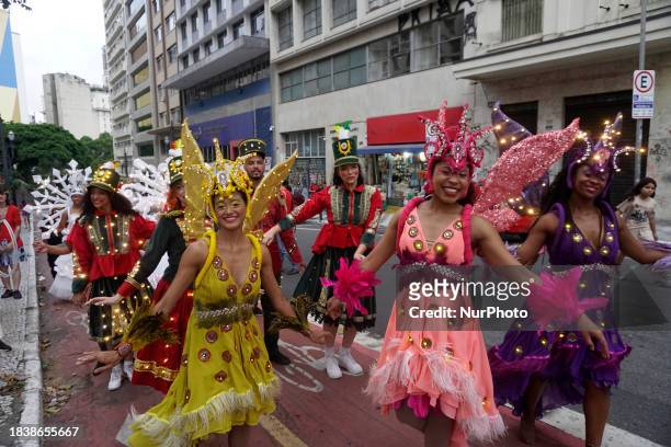 People are participating in the Parade of Lights in the center of Sao Paulo, Brazil, on December 8, 2023. The event is part of the Sao Paulo...