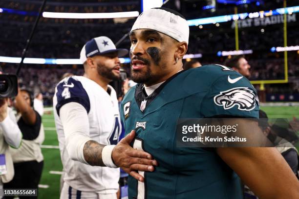 Jalen Hurts of the Philadelphia Eagles walks away after talking with Dak Prescott of the Dallas Cowboys after an NFL football game at AT&T Stadium on...