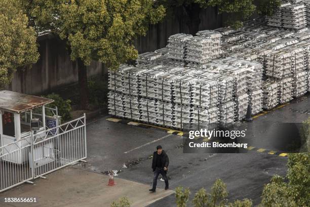 Stacks of aluminum ingots sitting in a stockyard in Wuxi, China, on Monday, Dec. 11, 2023. China is scheduled to release industrial production...