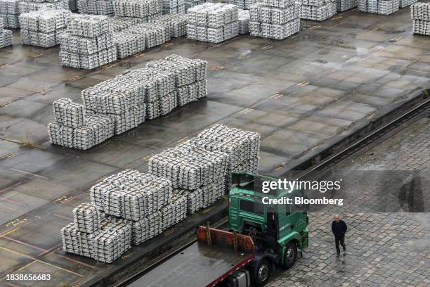 Stacks of aluminum ingots sitting in a stockyard in Wuxi, China, on Monday, Dec. 11, 2023. China is scheduled to release industrial production...