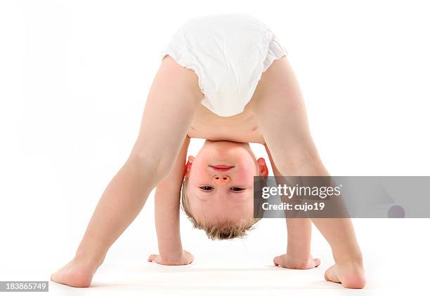 upsidedown play - kids in diapers 個照片及圖片檔