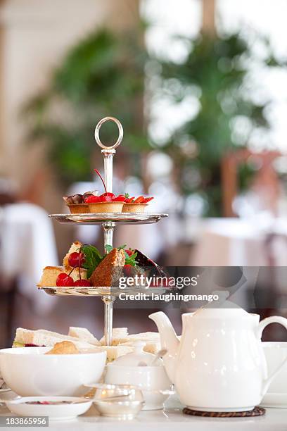 tea and bread set at a table in a restaurant - tea time stockfoto's en -beelden