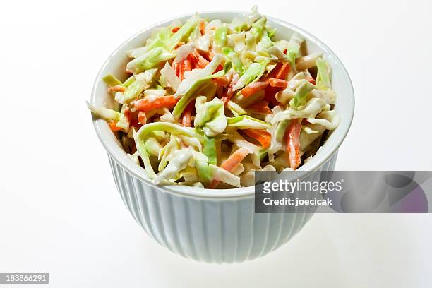 a bowl full of coleslaw on a white background - coleslaw stock pictures, royalty-free photos & images
