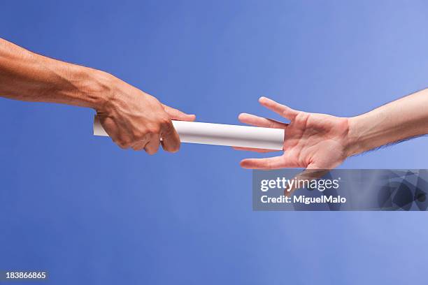 passing the baton - beton stock pictures, royalty-free photos & images