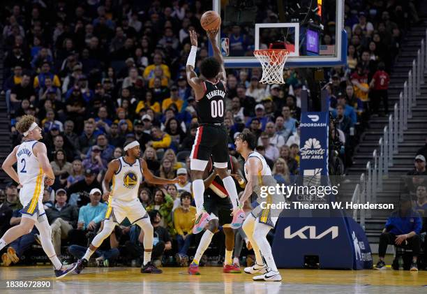 Scoot Henderson of the Portland Trail Blazers shoots over Dario Saric of the Golden State Warriors during the third quarter of an NBA basketball game...