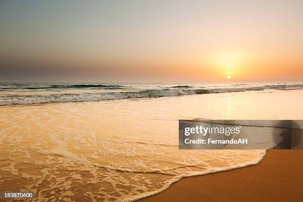 ocean beach sunset landscape view - andalucia beach stock pictures, royalty-free photos & images