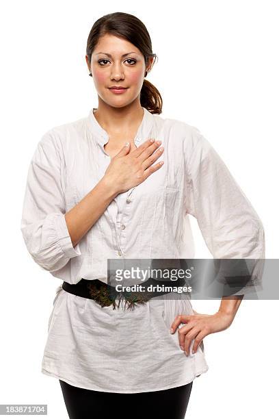 young woman with hand over heart - hand on chest stock pictures, royalty-free photos & images