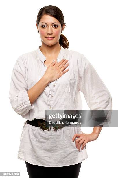 young woman with hand over heart - tunic 個照片及圖片檔