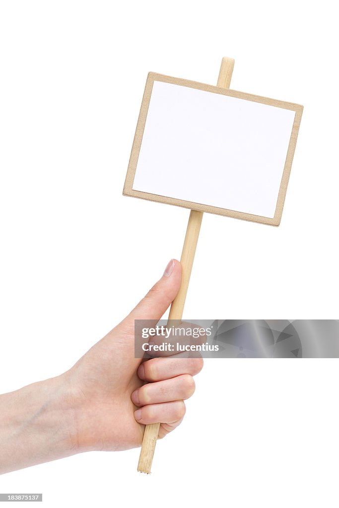 Human hand holding blank placard